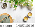 Green jasmine tea and flowers 140518016