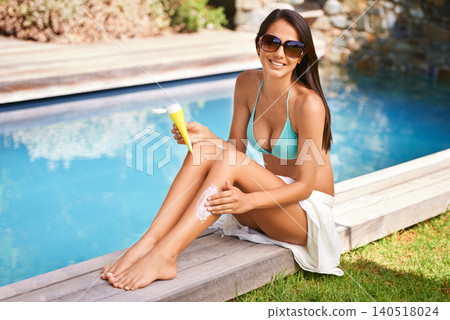 Woman, smile and swimming pool with sunscreen in summer for dermatology protection, vacation or sunbathing. Female person, sunglasses and lotion product for skincare health, relaxing or traveling Woman, smile and swimming pool with sunscreen in summer for dermatology protection, vacation or sunbathing. Female person, sunglasses and lotion product for skincare health, relaxing or traveling 140518024