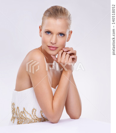 Portrait, woman and fashion in studio for elegant, classy or trendy style on isolated white background. Luxury, confidence and face of model for ballgown, dress or designer clothing for formal event Portrait, woman and fashion in studio for elegant, classy or trendy style on isolated white background. Luxury, confidence and face of model for ballgown, dress or designer clothing for formal event 140518052