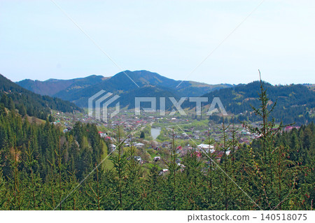 Panoramic view of Verkhovyna town in Carpathian Mountains valley with river Panoramic view of Verkhovyna town in Carpathian Mountains valley with river 140518075