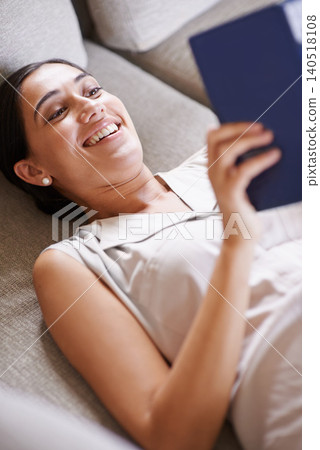 Woman, smile and relax on sofa with book, reading and learning with story and literature entertainment at home. Happy, female person in living room with fiction or comedy novel on couch for leisure Woman, smile and relax on sofa with book, reading and learning with story and literature entertainment at home. Happy, female person in living room with fiction or comedy novel on couch for leisure 140518108