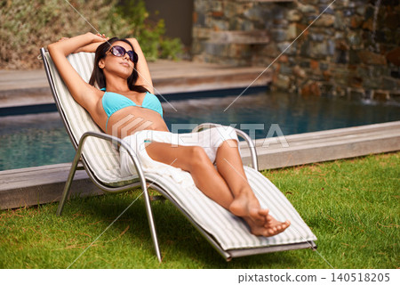 Woman, bikini and sunbathing at swimming pool for relaxing summer holiday in Hawaii or chill weekend, peace or stress relief. Female person, swimwear and calm at resort accommodation, travel or rest Woman, bikini and sunbathing at swimming pool for relaxing summer holiday in Hawaii or chill weekend, peace or stress relief. Female person, swimwear and calm at resort accommodation, travel or rest 140518205