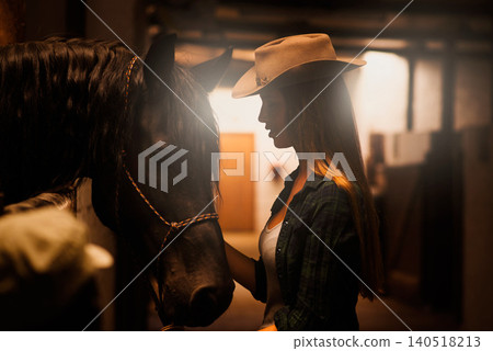 Cowgirl, friends and woman with horse at barn or stable in Texas for recreation. Western, female person and animal at ranch with pet or stallion for hobby with care for livestock at equestrian farm Cowgirl, friends and woman with horse at barn or stable in Texas for recreation. Western, female person and animal at ranch with pet or stallion for hobby with care for livestock at equestrian farm 140518213