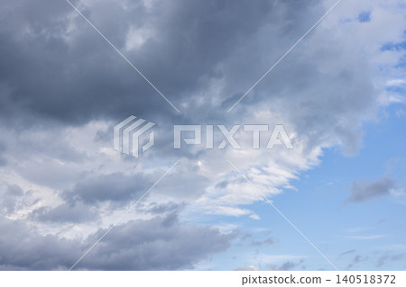 Dark storm clouds gathering against blue sky 140518372