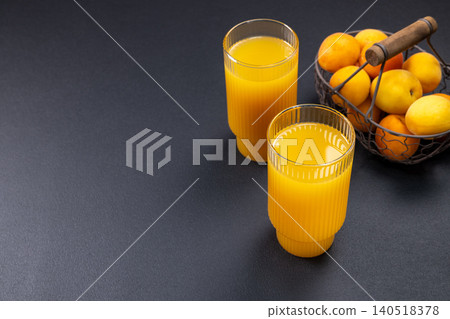 Apricot juice in glasses with fresh fruits Apricot juice in glasses with fresh fruits 140518378