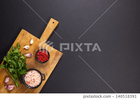 Fresh herbs and spices on wooden cutting board Fresh herbs and spices on wooden cutting board 140518391