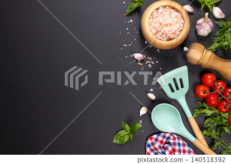 Cooking ingredients and utensils on dark background Cooking ingredients and utensils on dark background 140518392