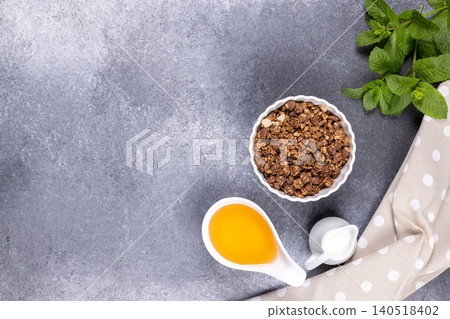 Healthy chocolate granola with honey, milk, and mint Healthy chocolate granola with honey, milk, and mint 140518402