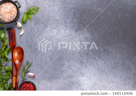 Cooking ingredients and herbs on a stone background Cooking ingredients and herbs on a stone background 140518406