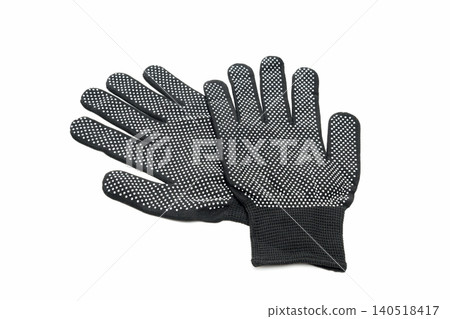 two working black gloves with white pimples lying crossed on each other on a white background two working black gloves with white pimples lying crossed on each other on a white background 140518417