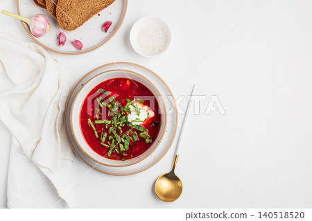 Borscht soup serving with sour cream and fresh herbs Borscht soup serving with sour cream and fresh herbs 140518520