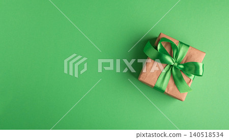 Gift box with green ribbon on background Gift box with green ribbon on background 140518534