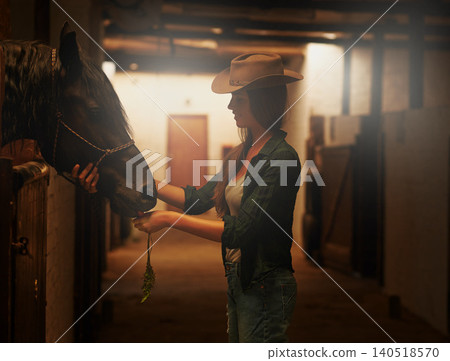 Cowgirl, smile and woman with horse at stable or barn in Texas for recreation. Western, animal and happy person at a ranch with pet, friendship and stallion for hobby with care at equestrian farm 140518570
