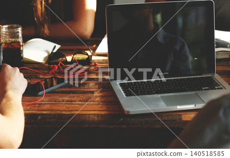 man drinking beer while using laptop 140518585