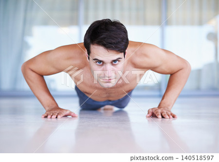 Man, portrait and push up for fitness, muscle training with body and self care in apartment. Serious athlete, exercise and endurance in workout for health, wellness for sports and challenge at home Man, portrait and push up for fitness, muscle training with body and self care in apartment. Serious athlete, exercise and endurance in workout for health, wellness for sports and challenge at home 140518597