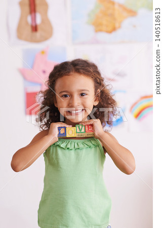 Girl, smile and learn with blocks in portrait, child development and growth with letters. Female person, kid and abc or alphabet for language, kindergarten and creative game for education at school Girl, smile and learn with blocks in portrait, child development and growth with letters. Female person, kid and abc or alphabet for language, kindergarten and creative game for education at school 140518613