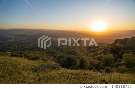 View of the mountains and Kislovodsk from the observation decks of the Kislovodsk Park. Evening sunset over the mountains of Kislovodsk. View of the mountains and Kislovodsk from the observation decks of the Kislovodsk Park. Evening sunset over the mountains of Kislovodsk. 140518733
