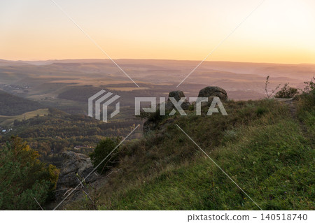 View of the mountains and Kislovodsk from the observation decks of the Kislovodsk Park. Evening sunset over the mountains of Kislovodsk. View of the mountains and Kislovodsk from the observation decks of the Kislovodsk Park. Evening sunset over the mountains of Kislovodsk. 140518740