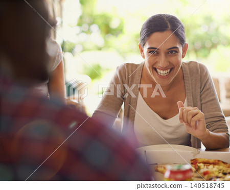 Pizza, happy and social gathering with group of friends eating together in restaurant for bonding. Smile, funny or laughing with young woman enjoying fast food for party, hunger or conversation Pizza, happy and social gathering with group of friends eating together in restaurant for bonding. Smile, funny or laughing with young woman enjoying fast food for party, hunger or conversation 140518745