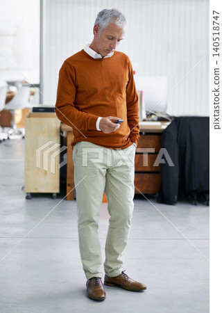 Senior, business man and typing on mobile phone in office for texting, email or checking schedule. CEO, technology and male person with smartphone for communication, social media or internet browsing Senior, business man and typing on mobile phone in office for texting, email or checking schedule. CEO, technology and male person with smartphone for communication, social media or internet browsing 140518747