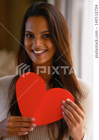 Woman, portrait and heart paper for kindness, care and love emoji for valentines day in home. Female person, happy and romance aesthetic or review and sign, shape and icon for peace or compassion Woman, portrait and heart paper for kindness, care and love emoji for valentines day in home. Female person, happy and romance aesthetic or review and sign, shape and icon for peace or compassion 140518784