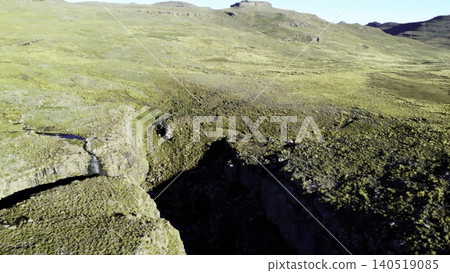 Drone Captures Shadowed Ravine With Steep Cliffs And Detailed Geological Features From Above. Media 140519085