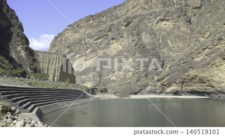 Calm Water With Surrounding Structures, Quiet Scene Showing Engineering Amidst Arid Canyon Scenery. Creative Calm Water With Surrounding Structures, Quiet Scene Showing Engineering Amidst Arid Canyon Scenery. Creative 140519101