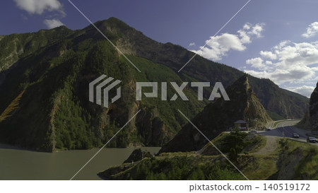 Sunshine Bathes Rugged Valley With Greenery, Radiant Valley Featuring Broad Muddy Stream And Lush Hills. Creative Sunshine Bathes Rugged Valley With Greenery, Radiant Valley Featuring Broad Muddy Stream And Lush Hills. Creative 140519172