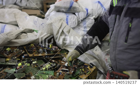 Hands Handle Circuit Board Recycling. Manual Inspection Of Electronic Parts For Sustainable Recovery. Creative Hands Handle Circuit Board Recycling. Manual Inspection Of Electronic Parts For Sustainable Recovery. Creative 140519237