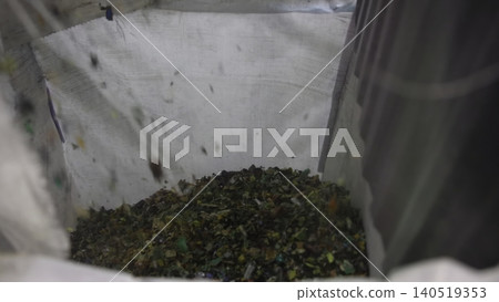 Warehouse Scene Showing Shredded Plastic Being Organized Into Containers For Reuse Process . Media Warehouse Scene Showing Shredded Plastic Being Organized Into Containers For Reuse Process . Media 140519353