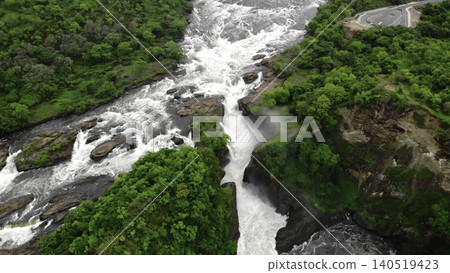 Aerial View Of Rocky Cascade, Overhead Perspective Of Waterfall With Surrounding Greenery And Mist. Media Aerial View Of Rocky Cascade, Overhead Perspective Of Waterfall With Surrounding Greenery And Mist. Media 140519423