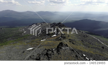Colorful Ridge With Blooming Wildflowers. Vibrant Alpine Landscape With Blooming Tundra And Distant Hills. Media Colorful Ridge With Blooming Wildflowers. Vibrant Alpine Landscape With Blooming Tundra And Distant Hills. Media 140519493