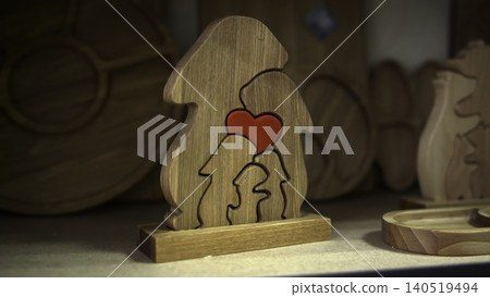 Decorative Wooden Puzzle Portraying Parent And Child With Warm Ambient Lighting Creating Sentimental Ambiance. Media 140519494