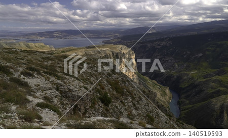 Overcast Canyon Boasts Rugged Cliffs, Cloudcovered Overlook Reveals Striking Geological Formations. Creative 140519593