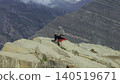 Wanderer Resting On Precipice Captures Breathtaking Canyon And Ridge Scenery In Peaceful Silence. Media 140519671