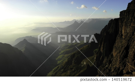 Sunset Mountain Vista. Photograph Capturing Grandeur Of Layered Valleys Beneath Glowing Sunset Sky. Media Sunset Mountain Vista. Photograph Capturing Grandeur Of Layered Valleys Beneath Glowing Sunset Sky. Media 140519672
