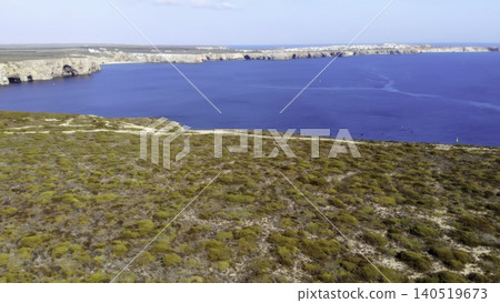 Scenic Coastal View. Aerial Perspective Of Serene Coast With Winding Paths And Distant Headlands. Media Scenic Coastal View. Aerial Perspective Of Serene Coast With Winding Paths And Distant Headlands. Media 140519673