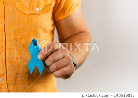 Support for health awareness with a blue ribbon held by a man 140519883