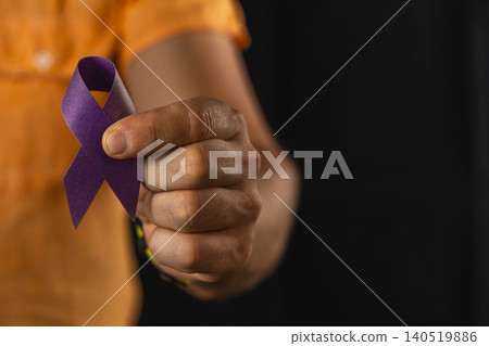 Support for health awareness with a ribbon held by a man 140519886