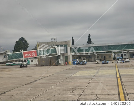Cordoba, Argentina - April 20, 2026: Ground handling activity at Ingeniero Ambrosio Taravella International Airport. Cordoba, Argentina - April 20, 2026: Ground handling activity at Ingeniero Ambrosio Taravella International Airport. 140520205