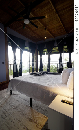 Eco lodge bedroom with tropical jungle view in costa rica Eco lodge bedroom with tropical jungle view in costa rica 140520613