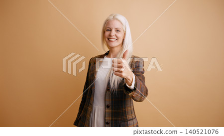 Happy woman giving thumbs up approving excellent work Happy woman giving thumbs up approving excellent work 140521076