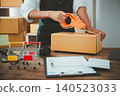 Online small business owner is packing products for customers according to their orders online-Shopping online concept. 140523033