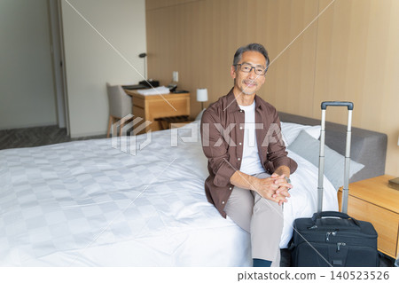 Senior men staying at a hotel during their trip Senior men staying at a hotel during their trip 140523526