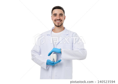 Doctor demonstrating dental care with a model smiling, on white Doctor demonstrating dental care with a model smiling, on white 140523594