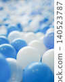 Blue and white ball pit background material for a kids' play area 140523787
