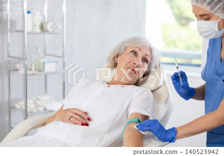 Untravenously injection elderly patient 140523942