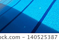 Blue swimming pool water with light and shadow contrast 140525387