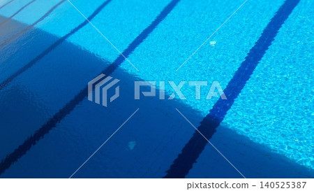 Blue swimming pool water with light and shadow contrast 140525387
