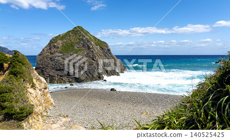 Honohoshi Beach, Amami Oshima: A pebble beach, triangular rocks, and a blue sky. 140525425